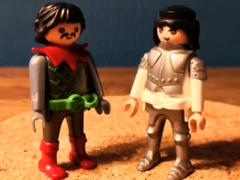 Zwei Playmobilmännchen unterhalten sich.